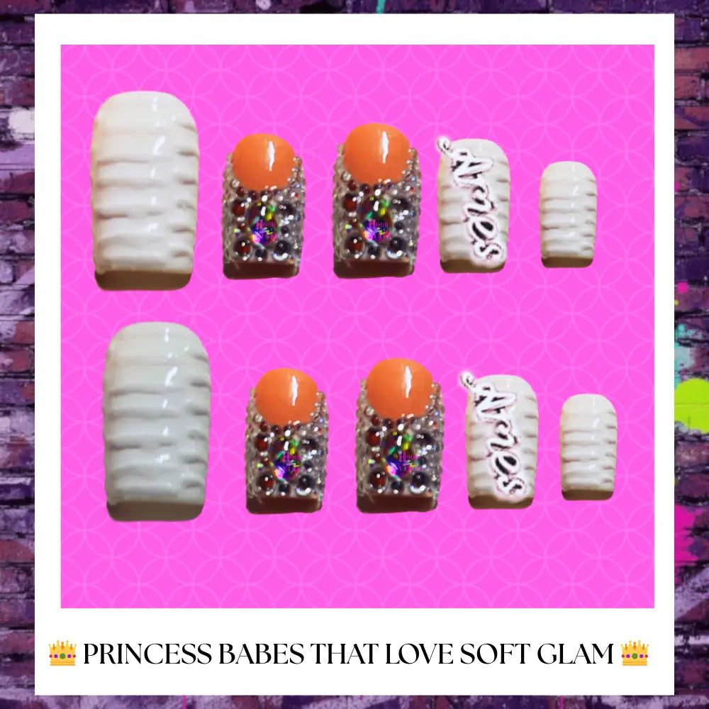 Luxury soft glam press on nails with glossy finish and princess-inspired design displayed on a blush pink glitter background.