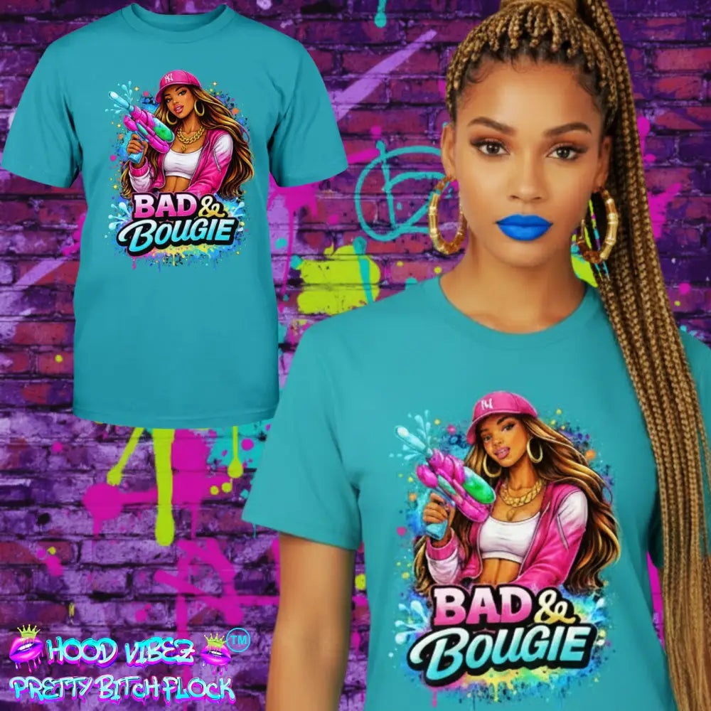 Bad & Bougie Energy graphic T-shirt featuring an urban baddie holding a water gun with colorful street art splash design on a teal tee