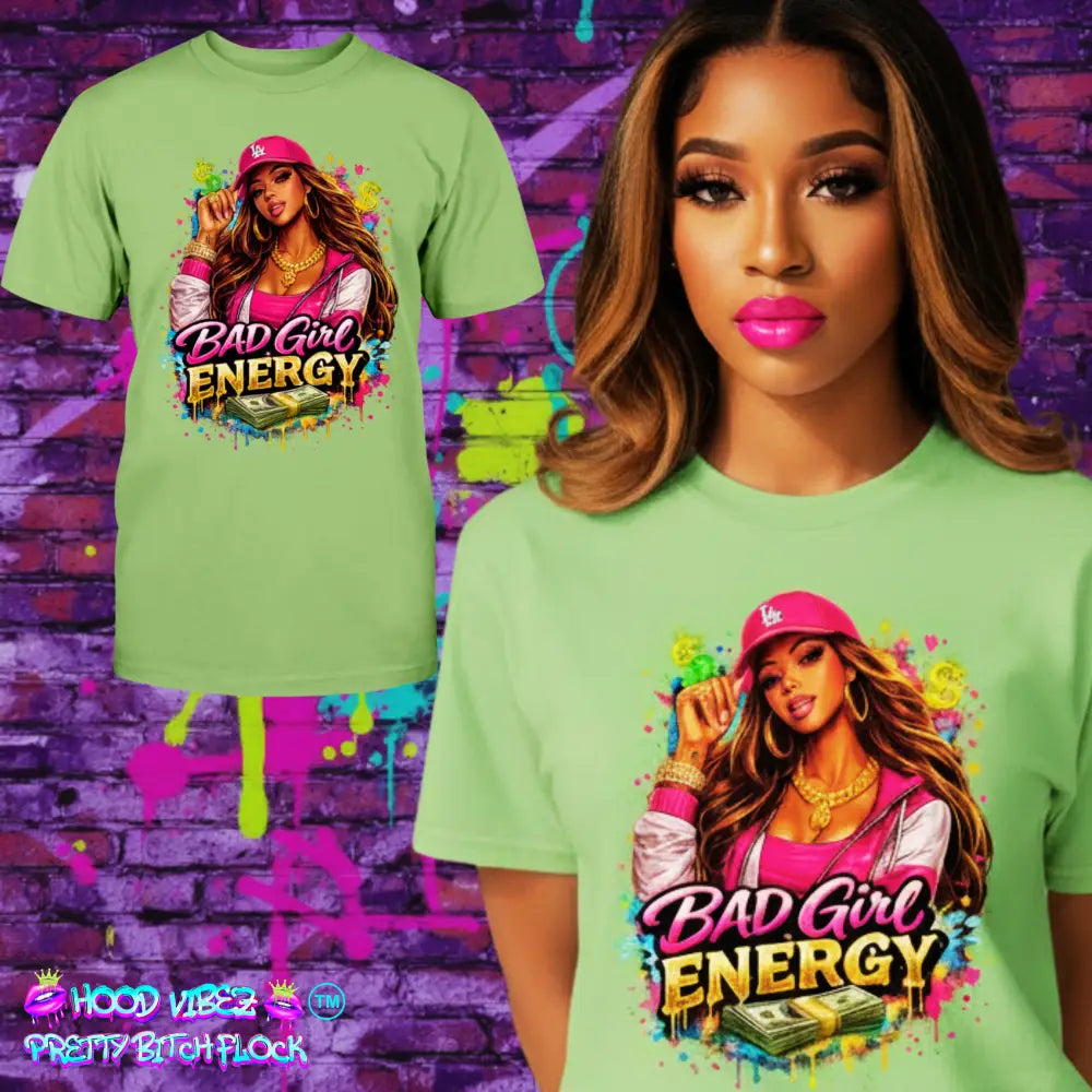 model wearing Bad Girl Energy graphic t-shirt with urban boss girl illustration, pink cap, gold jewelry, and cash design on lime green tee