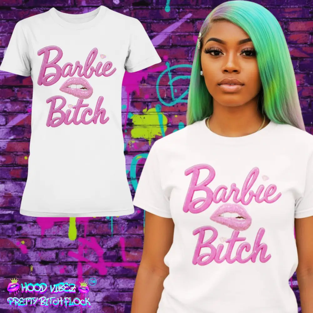 Person wearing a white t-shirt with 'Barbie Bitch' text in pink against a colorful graffiti wall.