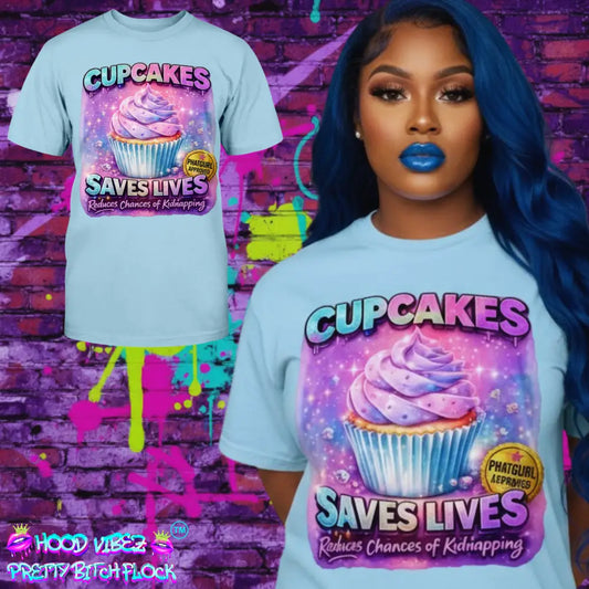 Cupcakes Saves Lives graphic tee featuring pastel cupcake illustration on blue t-shirt, funny cute women’s statement shirt by Hood Vibez Pretty Bitch Flock streetwear brand.
