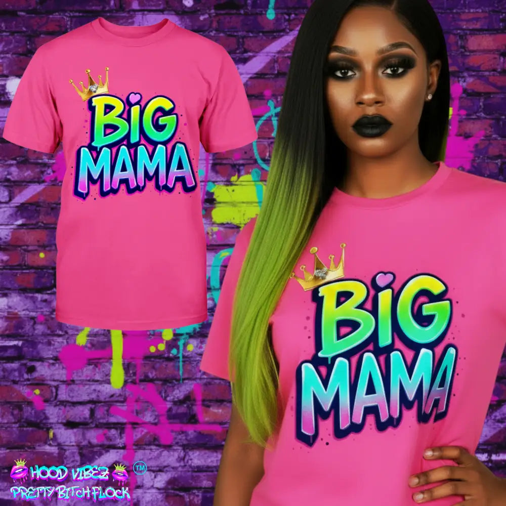 Pink t-shirt with 'BIG MAMA' design worn by a model against a colorful graffiti wall.