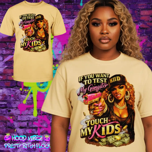Model wearing protective mom graphic t-shirt featuring bold “Don’t Test My Gangster Touch My Kids” statement with urban glam female artwork, money graphics, and boss mama attitude design on neutral tee.