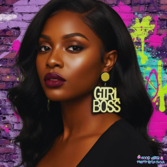 Girl Boss statement earrings featuring bold cream lettering with gold-tone accents on a glittering gold background.