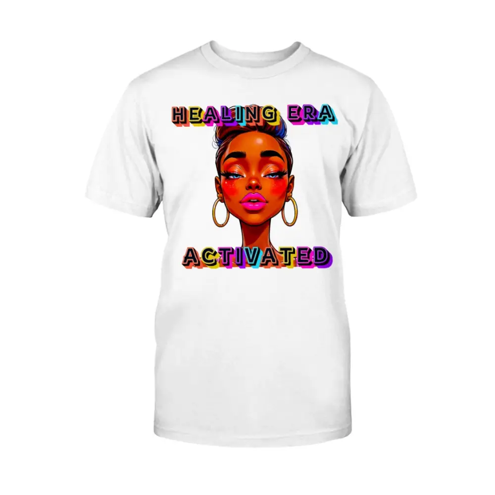 White t-shirt with a colorful graphic of a woman's face and text 'HEALING ERA ACTIVATED' on a white background