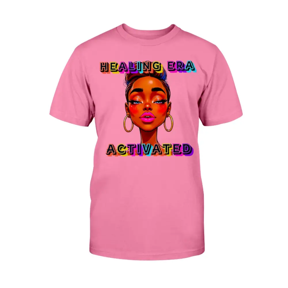 Pink t-shirt with a graphic of a woman's face and 'Healing Era Activated' text on a white background