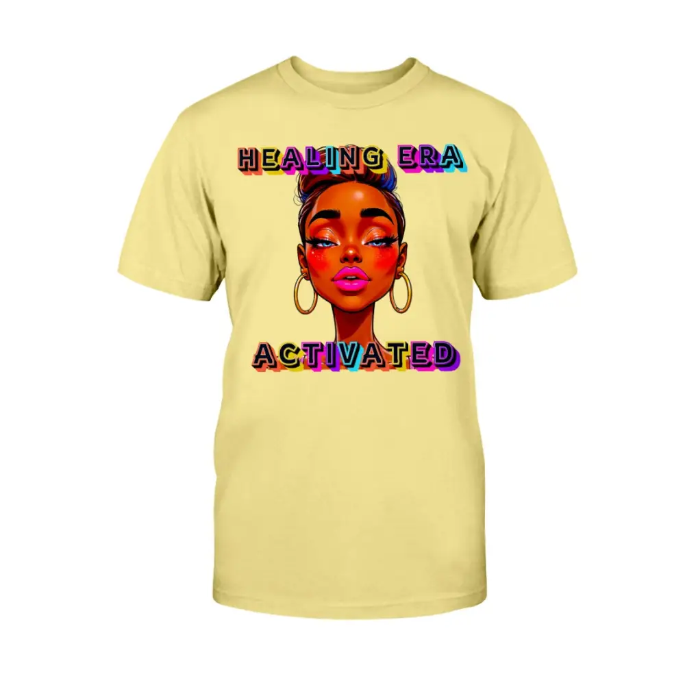 Yellow t-shirt with a colorful graphic of a woman's face and 'Healing Era Activated' text on a white background