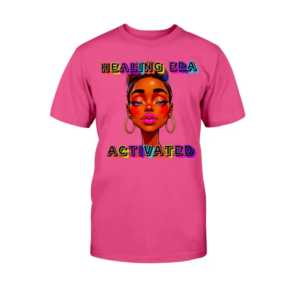 Pink t-shirt with a graphic of a woman's face and 'Healing Era Activated' text on a white background
