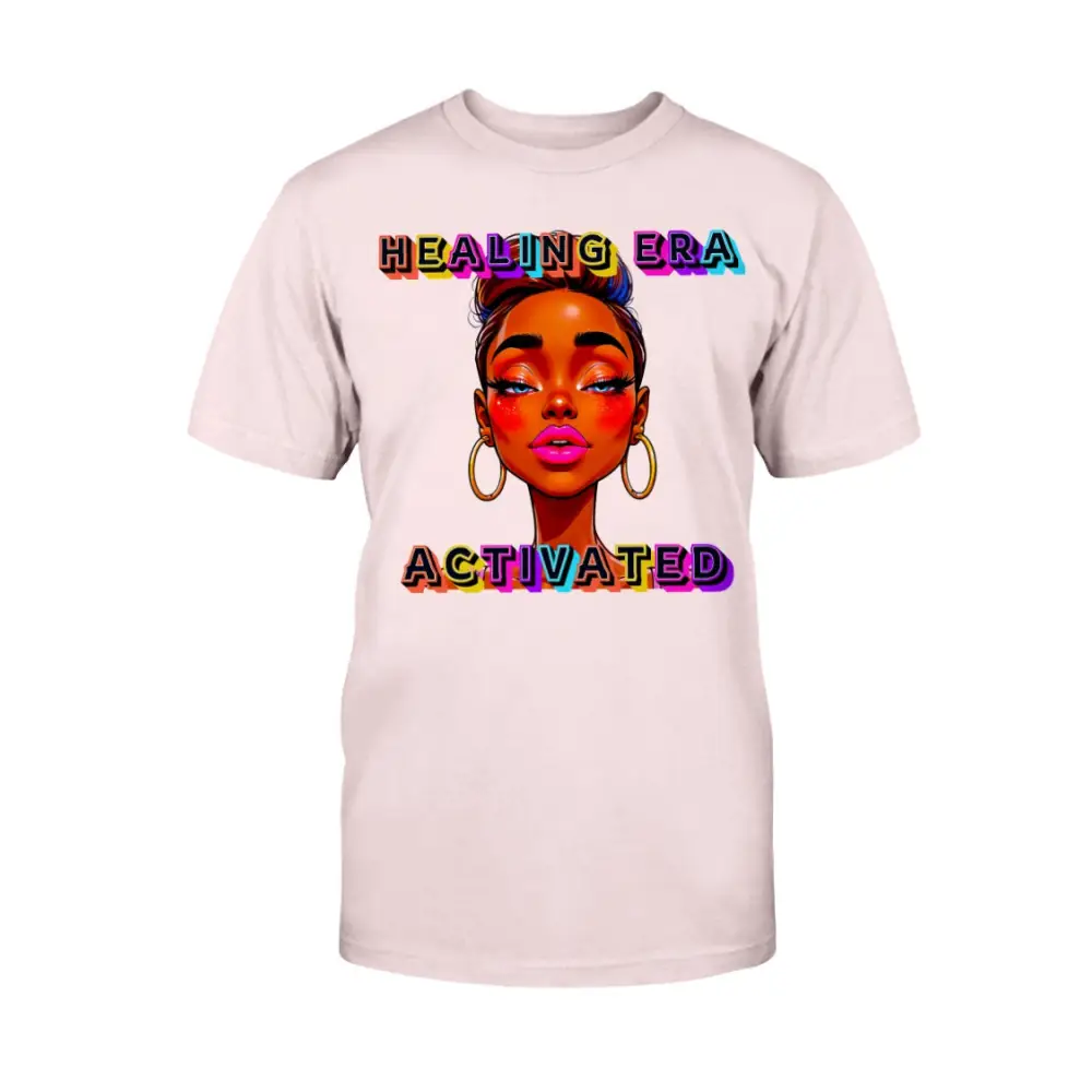 Pink t-shirt with a colorful graphic of a woman's face and 'Healing Era Activated' text on a white background