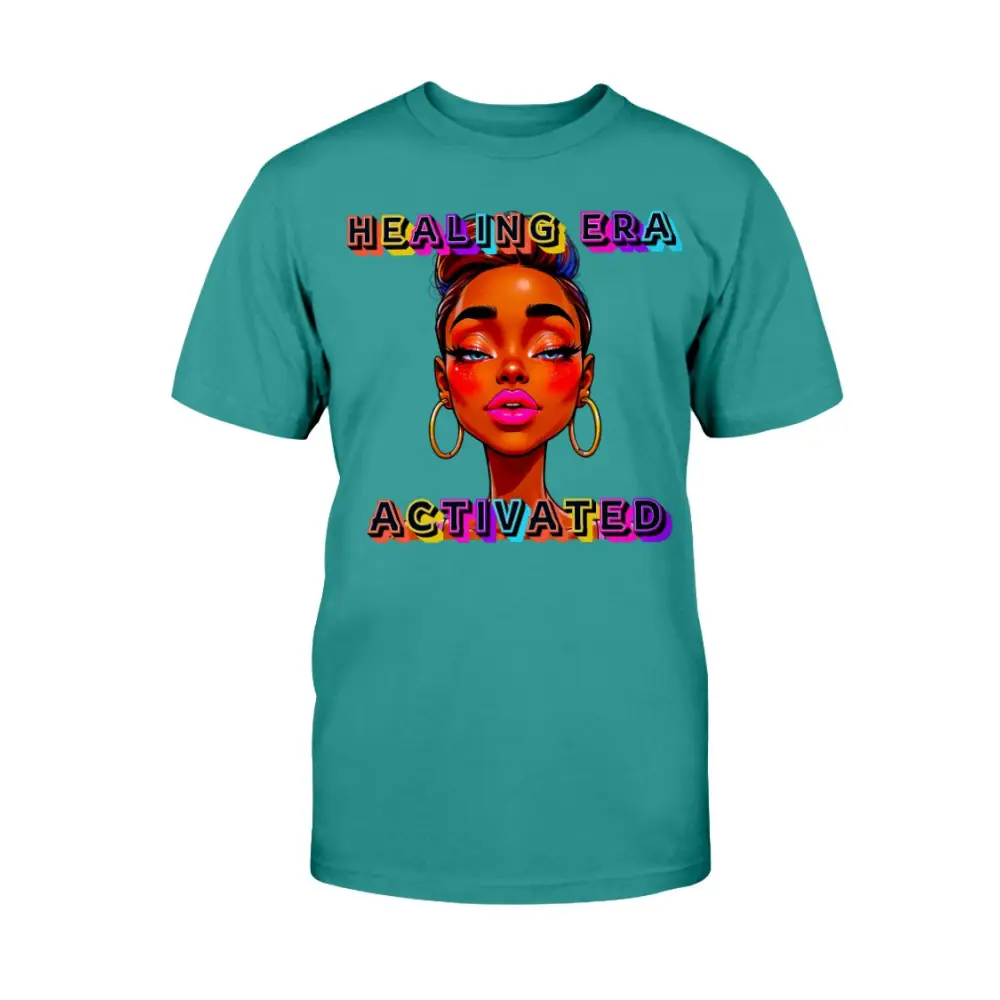 Teal t-shirt with a graphic of a woman's face and 'Healing Era Activated' text on a white background