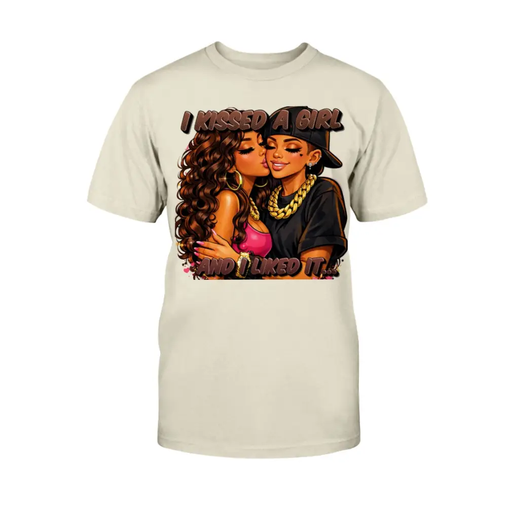 LGBTQ pride graphic t-shirt featuring two women kissing with bold urban cartoon artwork and “I Kissed A Girl & Liked It” text on tan tee