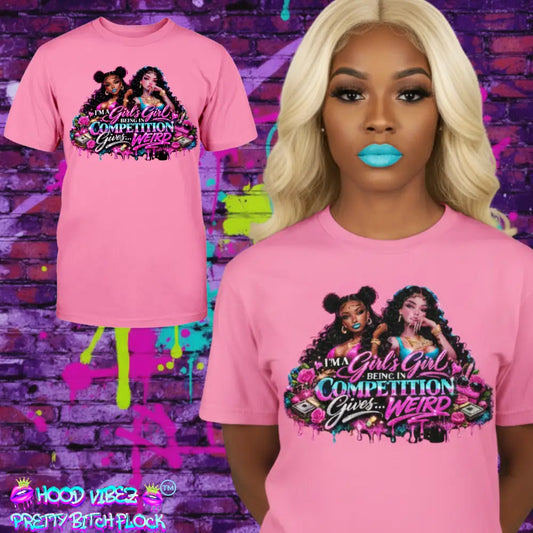MODEL WEARING PINK women’s graphic t-shirt featuring “I’m A Girls Girl” statement design with glam baddie artwork, beauty elements, money accents, and bold Pretty Bitch Energy streetwear style.