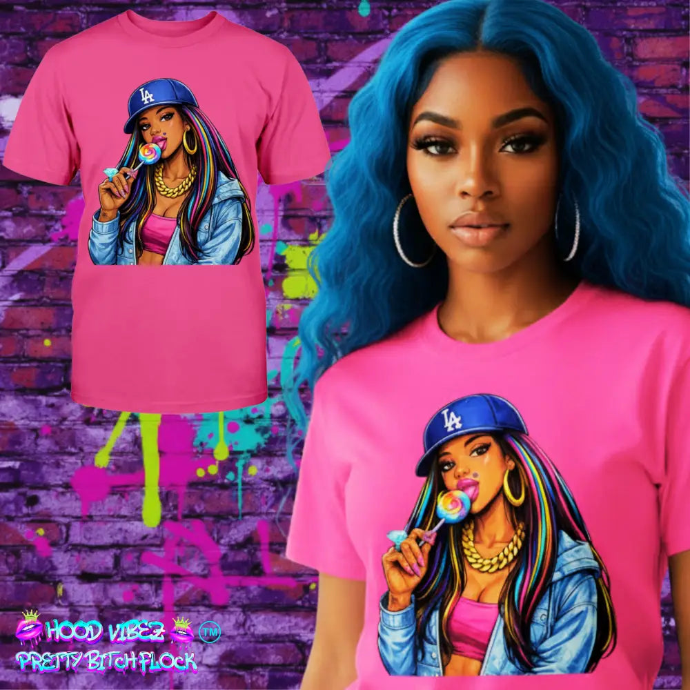 Pink t-shirt with a graphic of a woman holding a lollipop and wearing a LA Dodgers cap on a white background.