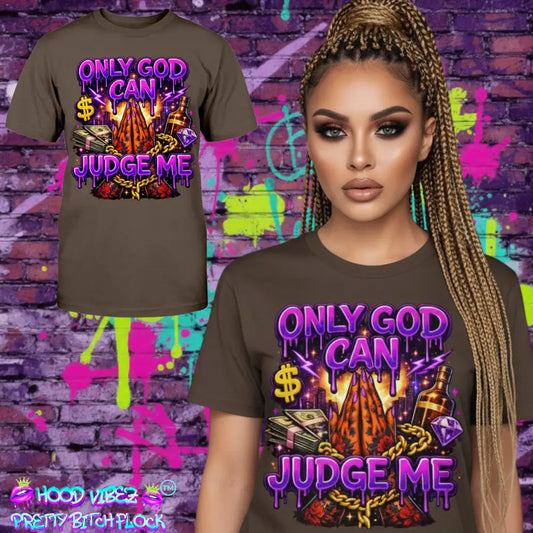 Only God Can Judge Me graphic tee featuring praying hands, money stacks, liquor bottle, diamond, and bold purple street art lettering on brown t-shirt streetwear design