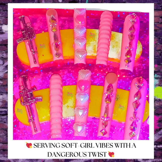 light pink long square press on nails with 3d hearts , textured ripples , rhinestone bling and a blinged out 3d Uzi 
