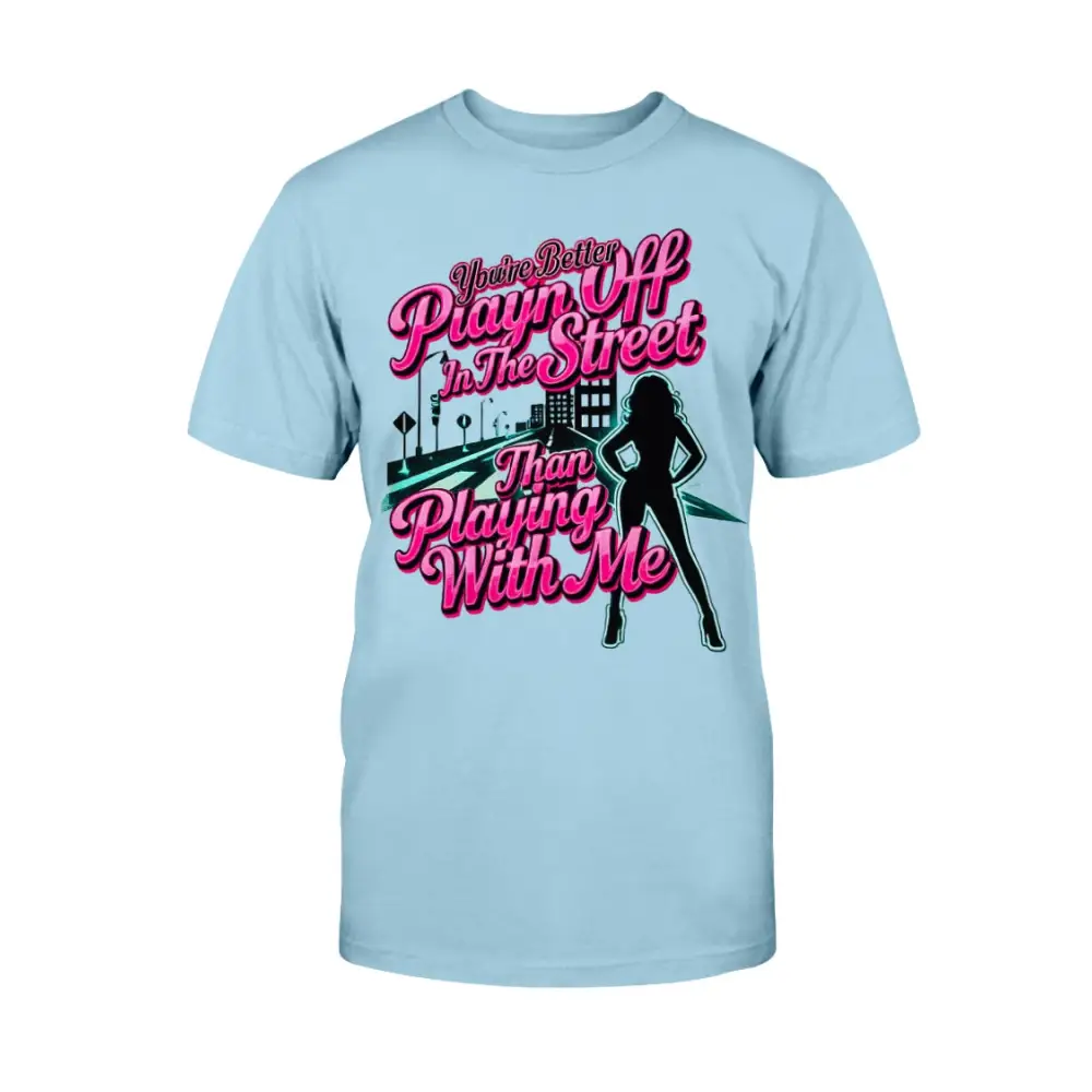 Light blue graphic t-shirt featuring bold pink statement text “You’re Better Playin’ In The Street Than Playing With Me” with urban city background and female silhouette design by Hood Vibez Pretty Bitch Flock.