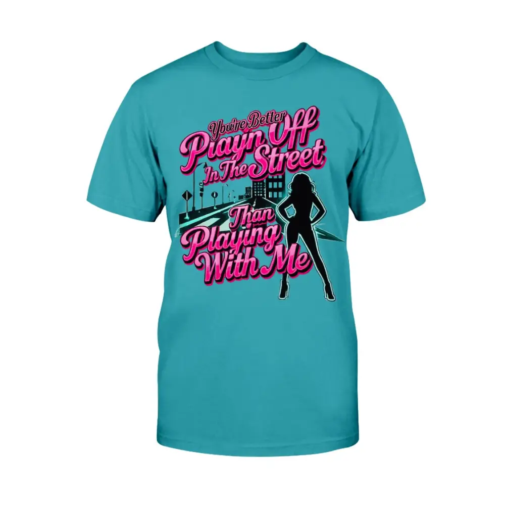Teal graphic t-shirt featuring bold pink statement text “You’re Better Playin’ In The Street Than Playing With Me” with urban city background and female silhouette design by Hood Vibez Pretty Bitch Flock.