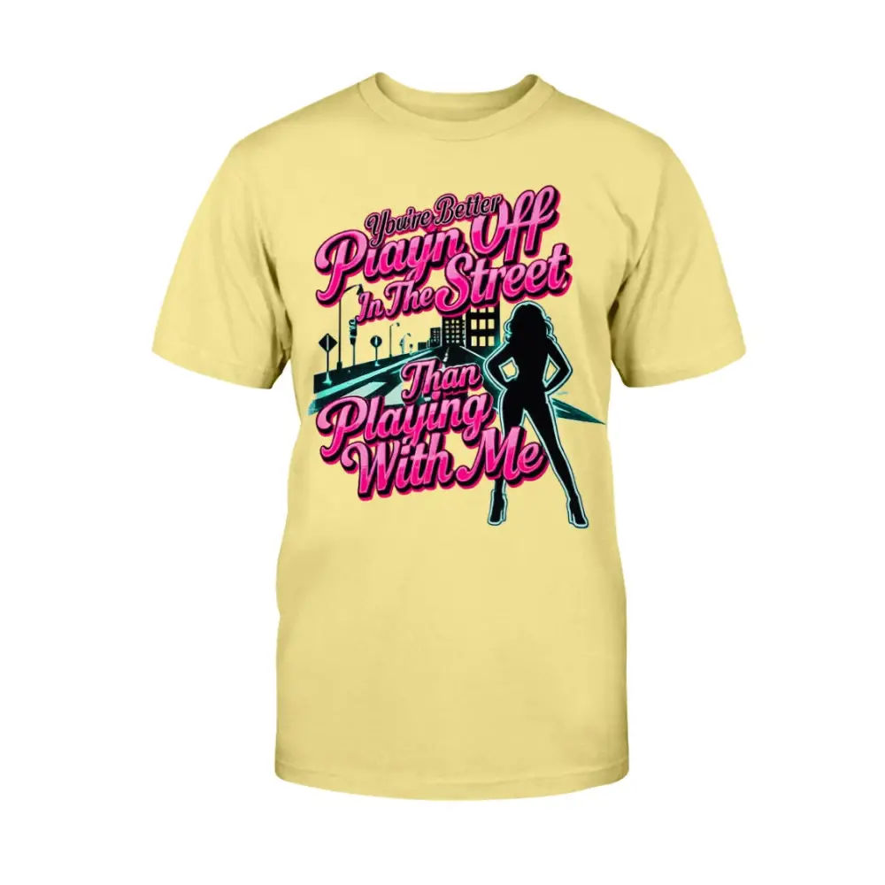 Yellow graphic t-shirt featuring bold pink statement text “You’re Better Playin’ In The Street Than Playing With Me” with urban city background and female silhouette design by Hood Vibez Pretty Bitch Flock.