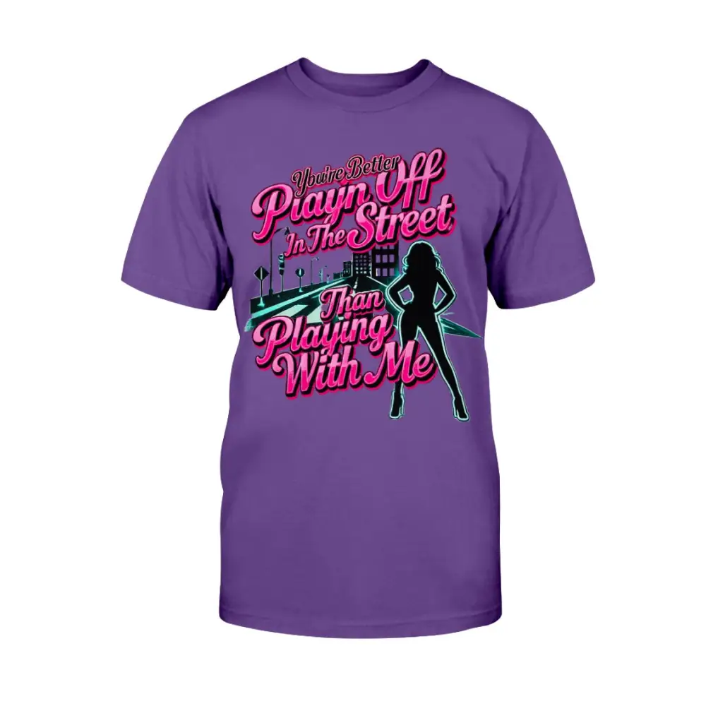 Purple graphic t-shirt featuring bold pink statement text “You’re Better Playin’ In The Street Than Playing With Me” with urban city background and female silhouette design by Hood Vibez Pretty Bitch Flock.
