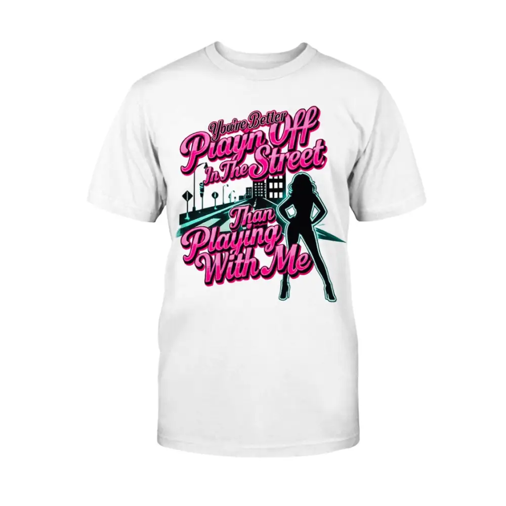 White graphic t-shirt featuring bold pink statement text “You’re Better Playin’ In The Street Than Playing With Me” with urban city background and female silhouette design by Hood Vibez Pretty Bitch Flock.