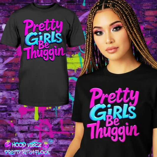 Black t-shirt with colorful text 'Pretty Girls Be Thuggin' worn by a model against a graffiti-covered wall.