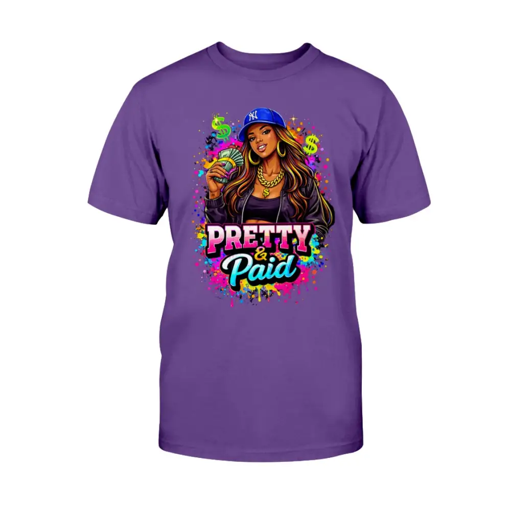 Pretty & Paid graphic t-shirt featuring urban boss babe holding cash, colorful street art background, and bold statement lettering on purple tee.