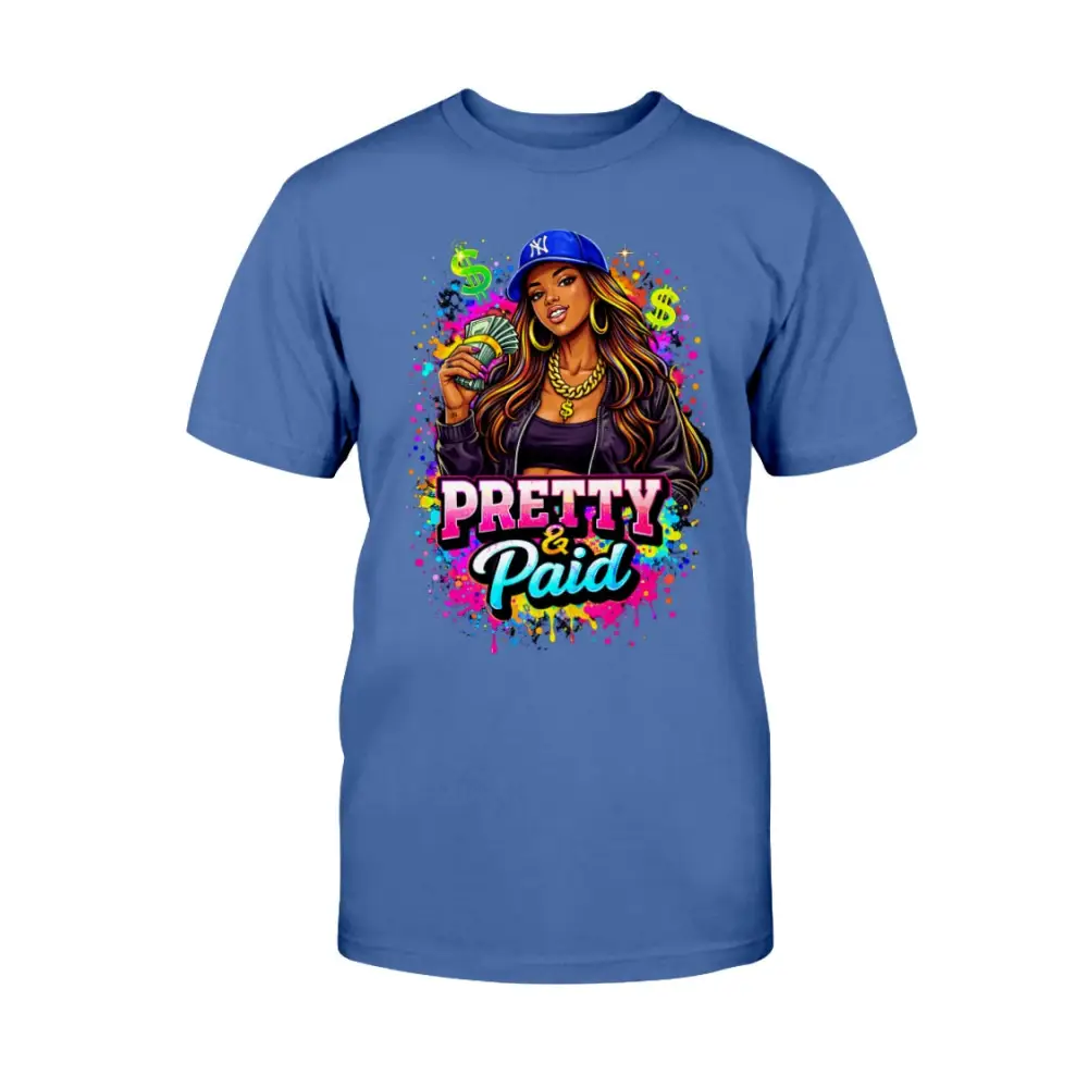 Pretty & Paid graphic t-shirt featuring urban boss babe holding cash, colorful street art background, and bold statement lettering on blue tee.