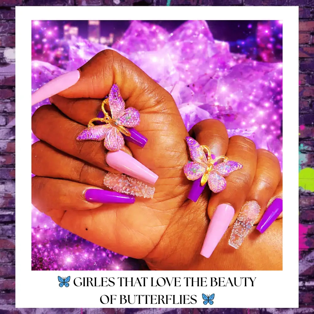 Custom butterfly press on nails with pastel pink and purple tones, crystal accents, and 3D butterfly charms on an urban-inspired background