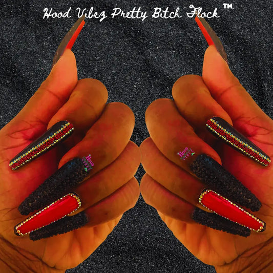 A set of press-on nails featuring black and red coffin-shaped nails with intricate bead coverage, and two accent nails with high-class designs. The brand logo 'Hood Vibes Pretty Bitch Flock' is visible on the image.