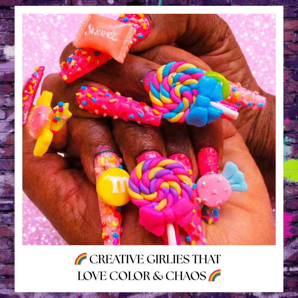 Extra-long candy-core press on nails with neon pink base, rainbow lollipop charms, gummy candy accents, sprinkles, and glossy finish on hands against a light pink glitter background.