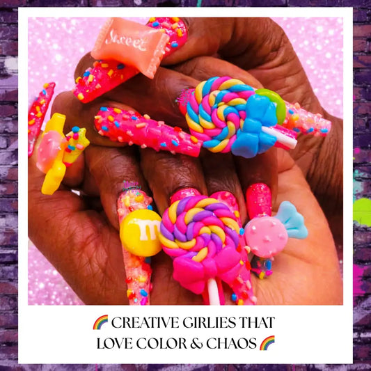 Extra-long candy-core press on nails with neon pink base, rainbow lollipop charms, gummy candy accents, sprinkles, and glossy finish on hands against a light pink glitter background.