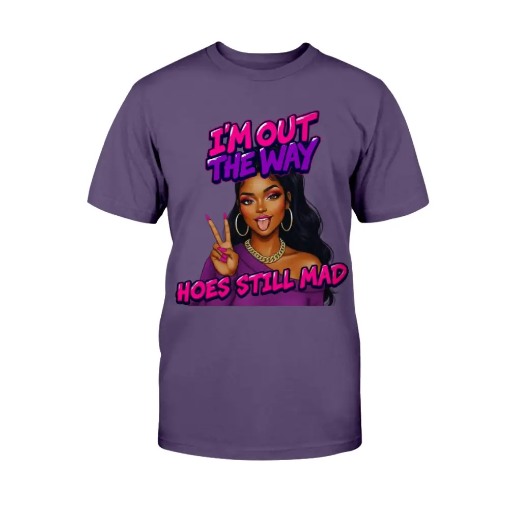 A purple women's t-shirt featuring a cartoon-style Black woman with long hair, hoop earrings, gold chain, and pink nails flashing a peace sign, with bold pink and purple text that reads “I’m Out the Way, Hoes Still Mad.”"