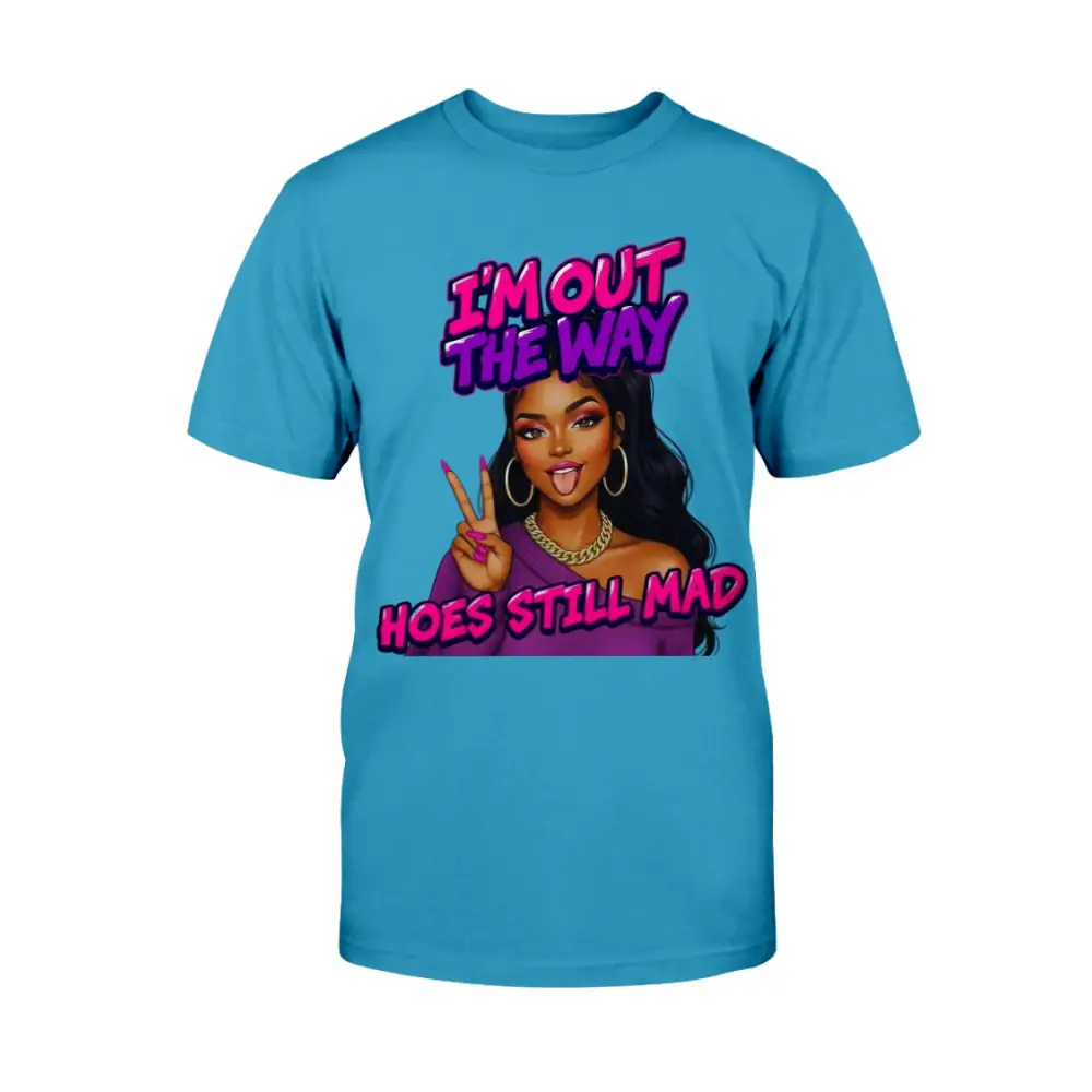 A blue women's t-shirt featuring a cartoon-style Black woman with long hair, hoop earrings, gold chain, and pink nails flashing a peace sign, with bold pink and purple text that reads “I’m Out the Way, Hoes Still Mad.”"