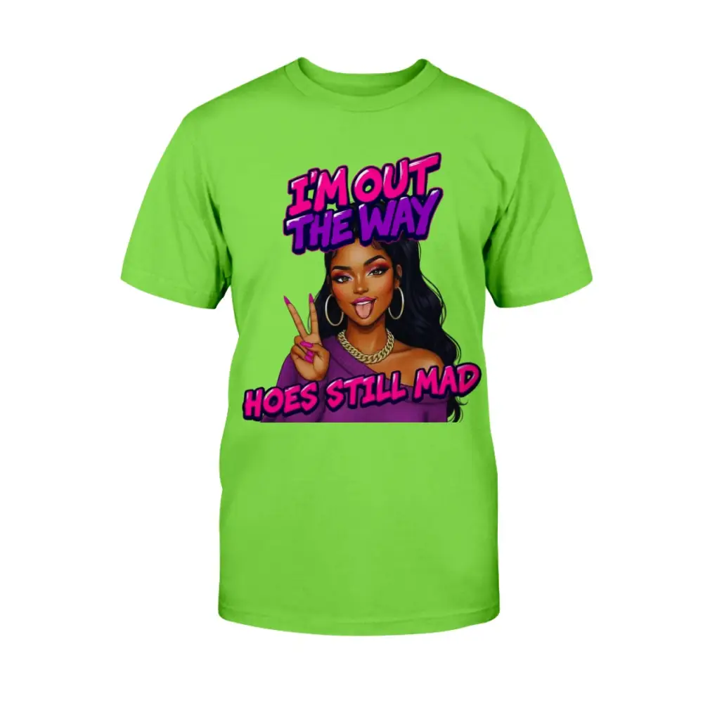 A neon green t-shirt featuring a cartoon-style Black woman with long hair, hoop earrings, gold chain, and pink nails flashing a peace sign, with bold pink and purple text that reads “I’m Out the Way, Hoes Still Mad.”"
