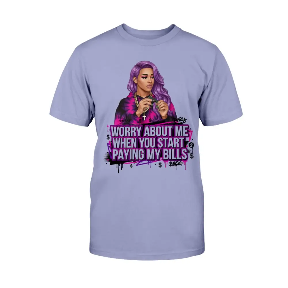Worry About Me When You Start Paying My Bills graphic t-shirt featuring bold purple lettering, money symbols, and confident illustrated woman with purple hair on lavender streetwear tee.